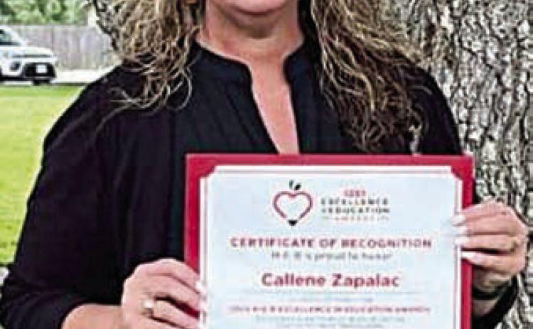 SHS Principal Callene Zapalac displays the certificate of recognition she received as a semifinalist for the H-E-B Education in Excellence Award.