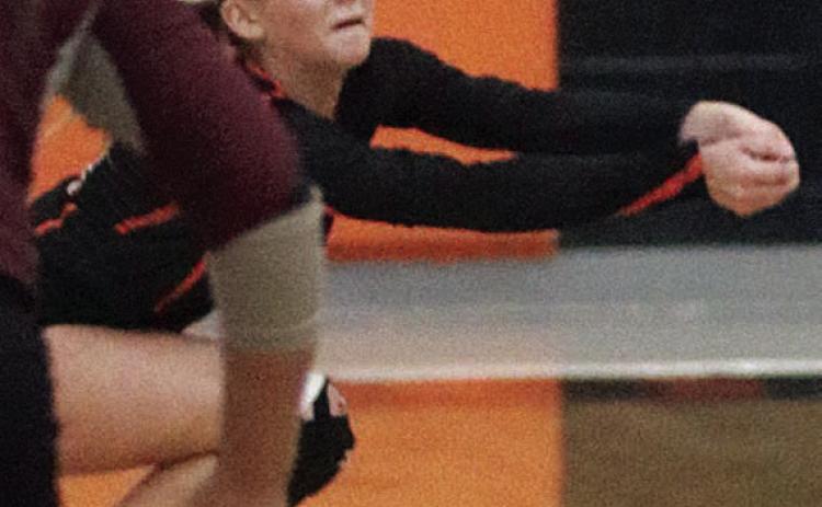 Mallory Bonner makes a lunging dig in the second set against East Bernard. Sticker Photo By Darrell Vyvjala