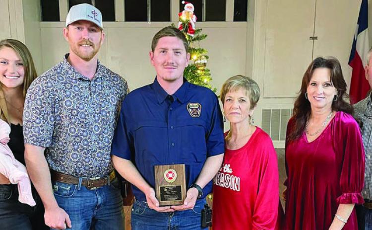 The Schulenburg Volunteer Fire Department’s OUTSTANDING SERVICE AWARD for 2023 went to Dylan Schilhab (center). He made the highest percentage of calls, meetings, and drills at 87 percent. The award is sponsored annually by the family of the late Chief Roland Proske. Making the presentation were: (from right) Jeff, Terry, and Pat Proske, as well as (from left) Kelsey and Doran Proske with their daughter Lace. Sticker Photo By Darrell Vyvjala