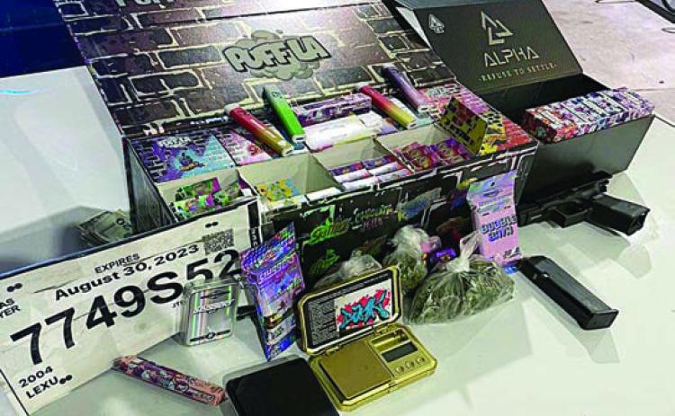 The items seized by the Schulenburg Police Department after a traffic stop on Aug. 22 are shown above, including the fake driver’s tag, drugs and drug paraphernalia, as well as a handgun.