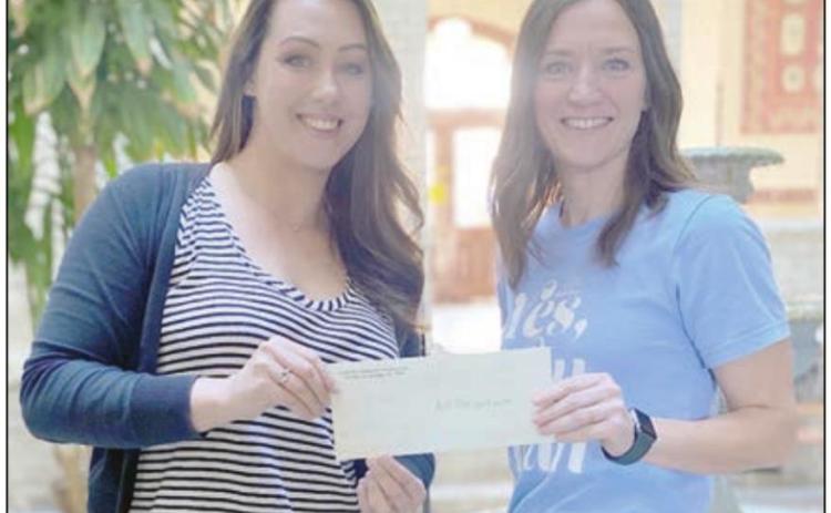 A $4,000 designated grant has been awarded by Fayette Community Foundation, represented by executive director Susannah Mikulin (left), to And Then a New Day, represented by founder Erin Wotipka (right).