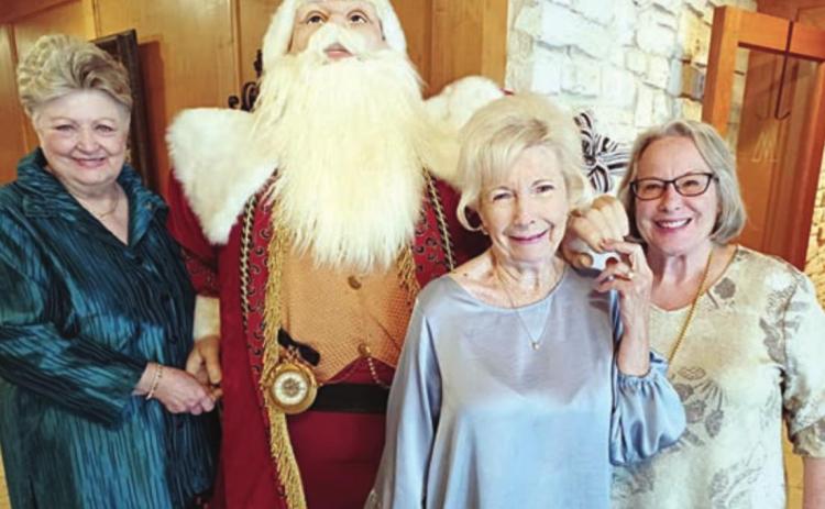Hostesses for the Garden Club Christmas luncheon were (from left) Patricia Greeson, Santa, Sharon Rankin and Nancy Tinsley.