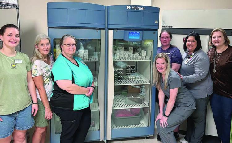 A high-tech laborator y refrigerator was purchased by St. Mark’s Medical Center with funds provided by Second Chance Emporium. Shown with the new piece of equipment are (front row, from left) Julia Thomas, SCE assistant store director; Gayle Schielack, SCE store director; Stacey Weyenberg, MLT, St. Mark’s; Valerie Otto, MT, St. Mark’s; (back row) Stacy Cada, SCE assistant store director; Amanda Fuchs, MT, director, St. Mark’s Laboratory Services; and Linda Morrison, SCE board secretary.
