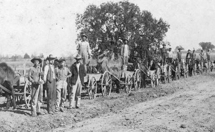 “The Cedar Farmers Good Road Club built over 5,000 yards of Good Road in 11 days in Feb. 1921 near La Grange, Tex. Gravel from 14 to 16 inches thick.”– Photograph by Louis Melcher/Courtesy of Fayette Heritage Museum &amp; Archives