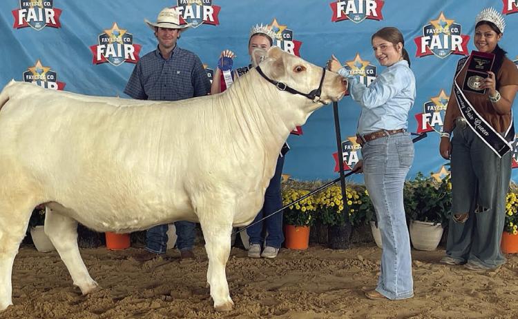 Kyrroll Prihoda (second from right), a member of the Schulenburg FFA, exhibited the overall grand champion heifer in the breeding beef heifer show at the Fayette County Fair, held Labor Day weekend at the Fairgrounds in La Grange. Prihoda’s overall champion heifer was also the grand champion exotic heifer. She also exhibited the reserve champion exotic heifer She is shown with judge Keaton Dodd (left) and two Fayette County Fair Queen representatives.