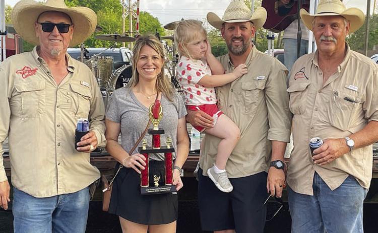 “BEER 30 COOKERS” – 2ND PLACE SAUSAGE-BASED CONCOCTIONS / SHOWMANSHIP – (from left) Arthur Mendoza, Emily and Jon Matus (holding daughter, Natalie), and Allen Matus.