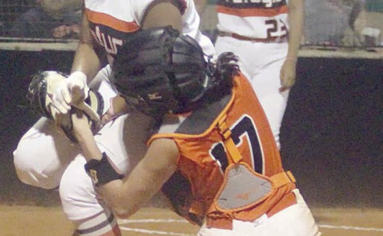 Catcher Kassidy Kubala tags out a Lady Bobcat trying to score in the top of the sixth inning of game 3. She took the throw from centerfielder Rilee Sanchez and was able to hang on to the ball after the collision in front of home plate. Sticker Photo By Darrell Vyvjala