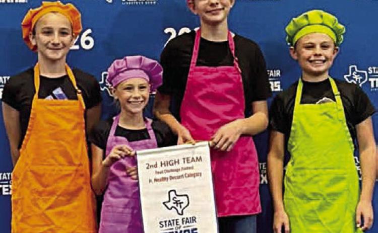 Two Fayette County 4-H teams competed in the State Fair of Texas Food Challenge contest on Monday, Sept. 28 in Dallas. The Fayette County 4-H junior team of (from left) Carolina Krebs, Addi Murphy, Kennedy Kaspar and Creed Kulhanek placed second in the junior healthy dessert category. All are members of the Fayetteville 4-H. In addition, the Fayette County 4-H senior team of Kandon Kaspar, Mackayla Griffin, Hailey Janish and Scotti Beseda, all members of the Fayetteville 4-H, entered the main dish category.