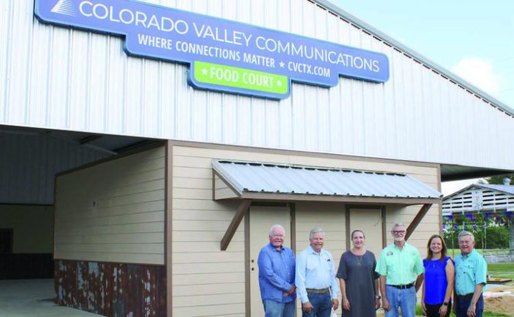 The Fayette County Fair food court now has a sign acknowledging the contributions of Colorado Valley Communications. Shown are (from left) CVCTX representatives John Wied-attorney, Gene Kruppaboard president and Karen Gunkel-director of regulatory affairs and marketing; Michal Zuhn, Fayette County Fair board president; and CVCTX representatives Amber Sternadel-customer relations supervisor and Kelly Allison-General Manager.