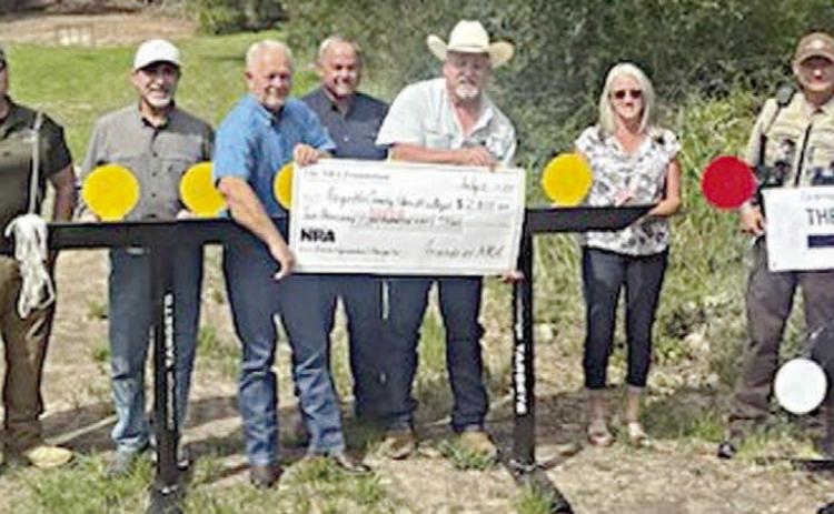 On hand as a $2,801 grant was presented by The NRA Foundation and Friends of NRA to the Fayette County Sheriff's Office were (from left) Charlie Murray; Investigator Kenn Kretz of the FCSO; John Salem, Dennis Brower and Craig Schulz; Sheriff Keith Korenek; Lazy Q Ranch &amp; Training Facility manager Lori Gray; and Sgt. Ron Naumann and Lt. David Beyer of the FCSO.