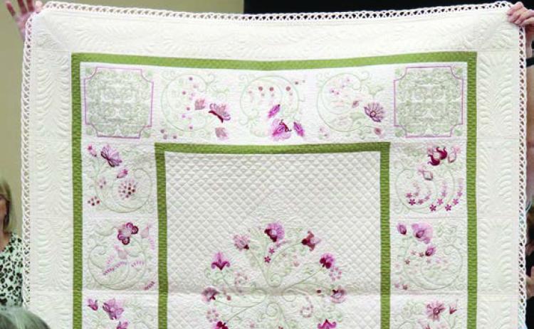 Quilting and looped binding technique example given.