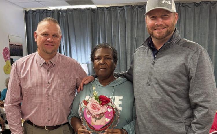 Bingo – Members have extra fun when Precinct 4 County Commissioner Drew Brossmann (right) joins them for bingo. He brought along Paul Zapalac (left), Precinct 4 Justice of the Peace, on his most recent visit. Alfreda Ellison (center) holds the blackout prize, created by Martha Beckmann, and had to win two playoffs to secure this Valentine’s creation.