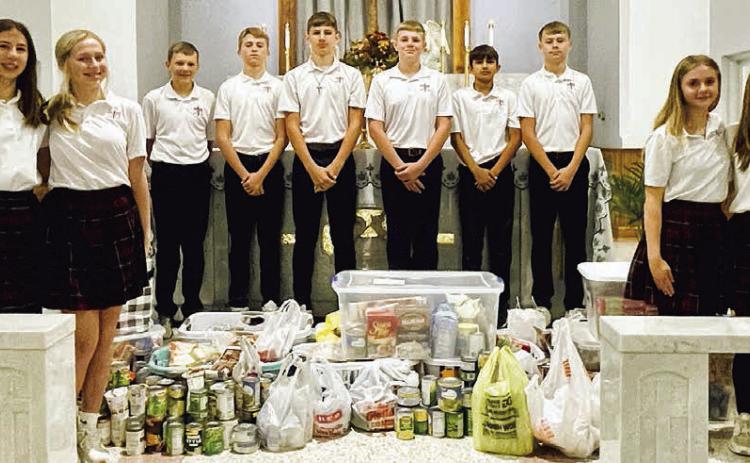 St. Rose collects for Family Crisis Center, SaFP at Thanksgiving Mass