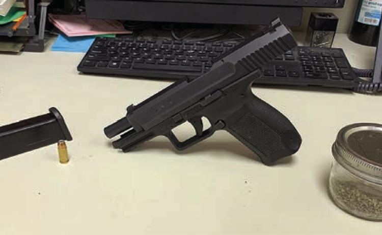 A 9 mm handg un and mari juana were confiscated after a road rage incident led to a traffic stop and arrest on Interstate 10 near Schulenburg on Sunday, May 21.