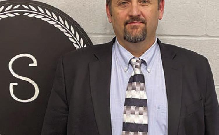 Lee Hartsell poses for a photo in the office he’ll soon occupy as Schulenburg junior high principal. Sticker Photo By Darrell Vyvjala