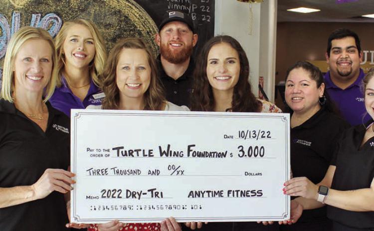 Turtle Wing Foundation was the recipient of a $3,000 donation as a result of the Dry-Tri. On hand were (front row, from left) Kim Bubela, Anytime Fitness Schulenburg; Deann Hooper and Destiny Psencik, Turtle Wing Foundation; Amanda Brown, Anytime Fitness Schulenburg; Anyssa Delagarza, Anytime Fitness Yoakum; (back row) Lauren Ralph, Anytime Fitness Schulenburg; Mitch Bailey, Anytime Fitness Schulenburg; and Abraham Centeno, Anytime Fitness Yoakum.