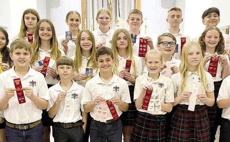 Grade 5-8 winners – (front row, from left) Rilee Wright, Levi Johnson, Barett Redman, Jack Schiffli, Briley Hartensteiner, Brynn Bubela, Abraham McBride, (middle row) Anna Oeding, Miranda Bonner, Reese Dusek, Mallory Bonner, Patrick Taylor, Caroline Bartek, Charlotte Schmidt, (back row) Allen Ballard, Valerie Sedlar, Jenna Guentert, Ashtyn Schaefer, Bo Brossmann, Weston Hollas and Max Hernandez.