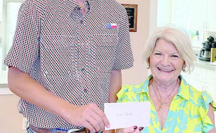 Scholarship – Duke Sodek, Fayette County Czech Heritage Society scholarship recipient, receives a $500 check from CHS president Betty Danner.