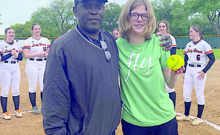 Turtle Wing Games get under way – Emma Kubala (right) threw out the first pitch at the Schulenburg Lady Horn softball game on Tuesday, March 19 during the school’s Turtle Wing Game. It was the first Turtle Wing Game of the season and Kubala’s pitch was a strike! Kubala is shown with Schulenburg High Head Softball Coach Gilbert Price (left).