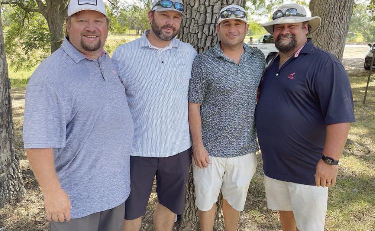 First Flight, First Place (15 under par / 57) – (from left) Kevin Kalina, Clayton Besetzny, Tommy Brown, and Pat Kalina. Sticker Photo By Darrell Vyvjala