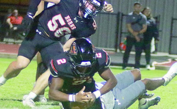 Mehki Wilson dives on a loose ball after he and Preston Kahn (No. 58) pressured Rice quarterback Kor’Dae Johnson to cause a fumble in the second quarter. Sticker Photo By Darrell Vyvjala