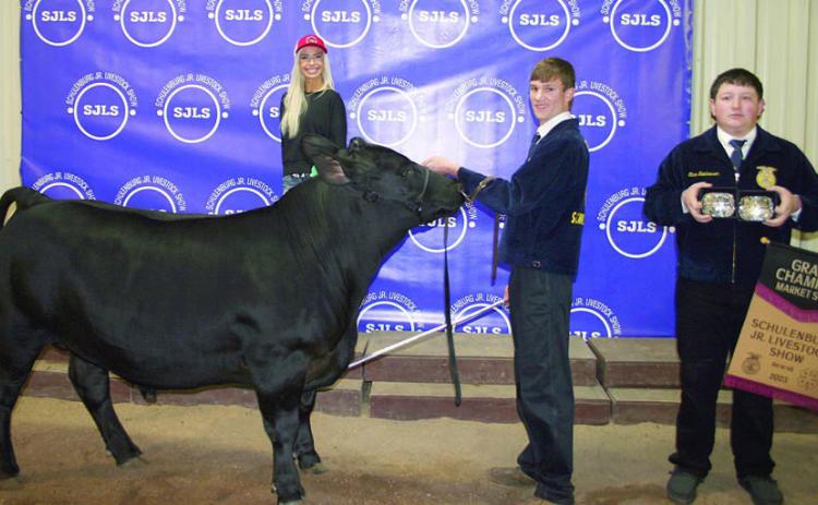 GRAND CHAMPION MARKET STEER – Exhibitor: Grant Kubala (second from right). Sales price: $10,000. Sticker Photo By Darrell Vyvjala