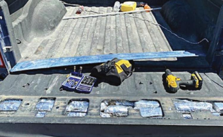 The meth and cocaine were concealed in a compartment in the tailgate of a Dodge pickup.