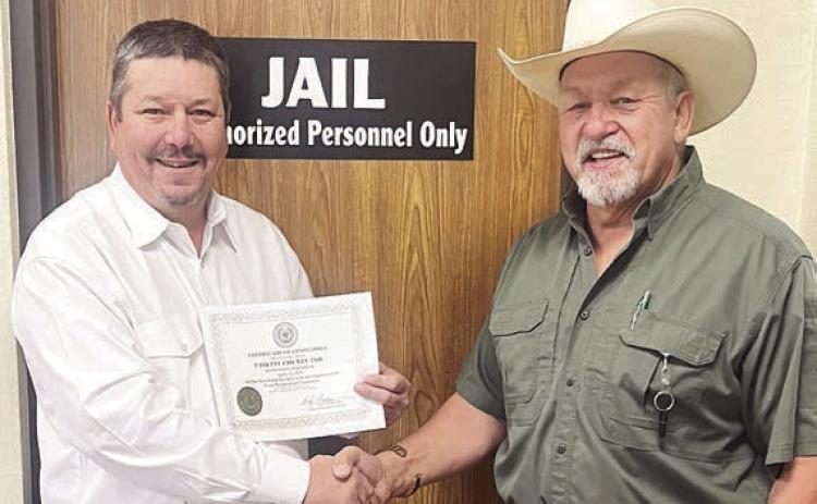 The Texas Commission on Jail Sta ndards issued a Certificate of Compliance to the Fayette County Jail, displayed by Jail Administrator Brad Neville (left) shown with Sheriff Keith Korenek (right).