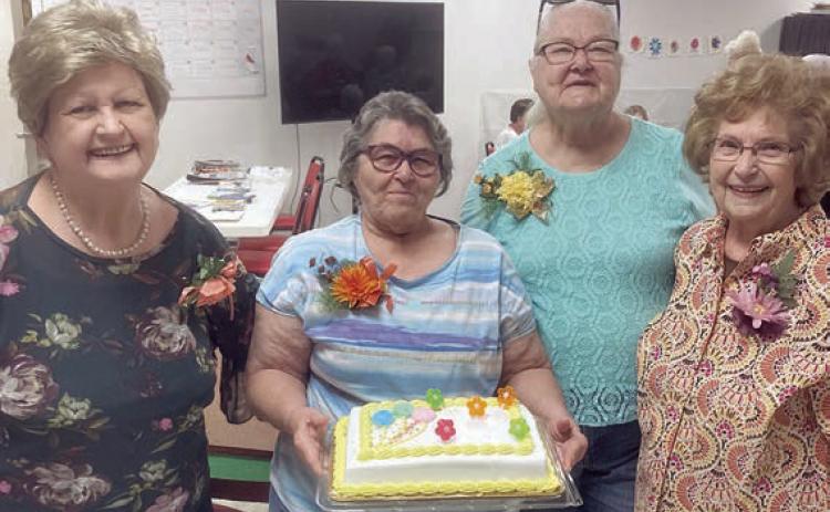 Birth days of th e Mo nth for September were celebrated by (from left) Judy Klesel, Carolyn Moore holding the cake, Betty Gabler and Jannette Hoelscher.