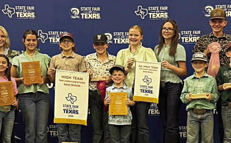 The Fayette County 4-H group shown holding awards from the State Fair of Texas Livestock Judging Contest includes (from left) coach Kaci Carrales, Crockett Guenther, Laramie Laake, Emma Zweschper, Hailey Janish, Adalyn Carrales, Tate Fritsch, Hudson Holub, Hazen Holub, Kaisley Janecka, Tatum Fritsch, Rowdy Guenther, Holden Holub, Joe Carrales, Rheagan Karisch and Rilan Karisch. Not shown is Abigale McBride.