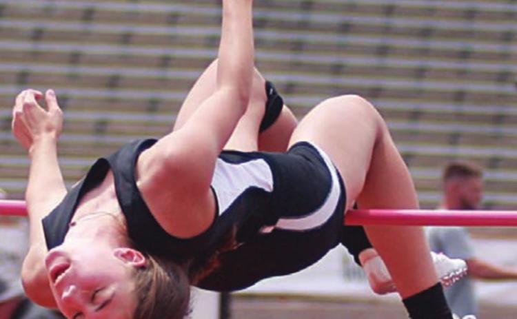 Meredith Magliolo successful clears 5-feet, 3-inches on her first attempt, which ultimately earned her a silver medal at state. Sticker Photo By Darrell Vyvjala