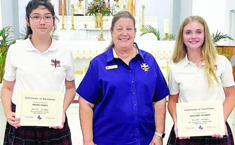 St. Rose of Lima students presented certificates at the end of the school year as first-place winners in the state Catholic Daughters of America Education Contest were Raven Demel (left), Division 1 Poetry, and Mallory Bonner (right), Division 2 Computer Art. Also shown is CDA Regent Grace Lebeda (center).