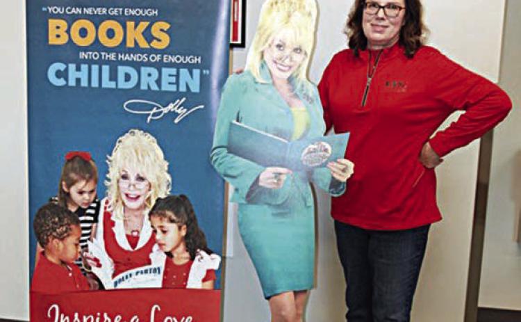 Fayette Electric Cooperative marketing and training manager Tracy Denton poses next to “Dolly,” who travels around Fayette and surrounding counties to spread the word about FEC’s partnership with the Dolly Parton Imagination Library.