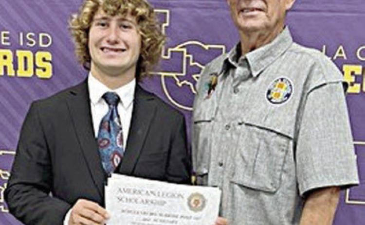 Cody Krupala (left), a La Grange High academic excellence awards recipient, was recently awarded a $1,000 scholarship from American Legion Post 143 in Schulenburg. Cody’s grandfather, Legion Post 143 member Eugene Krupala (right), made the presentation on Thursday, May 9 at the La Grange High scholarship recognition program. Cody will attend A&amp;M University at Kingsville and major in range and wildlife management.