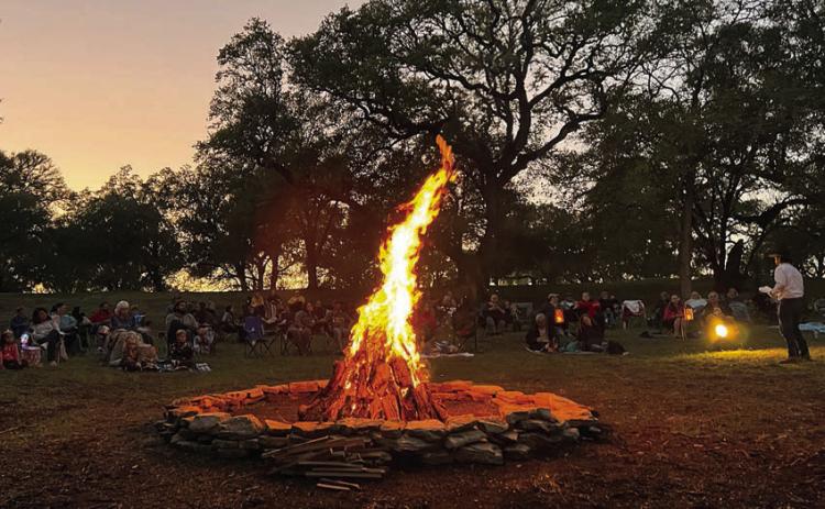Around sunset on Friday, Oct. 27, eerie but entertaining stories will be told at Monument Hill &amp; Kreische Brewery State Historic Sites. The photo shows a previous presentation as the audience heard the tales with a campfire as a backdrop.