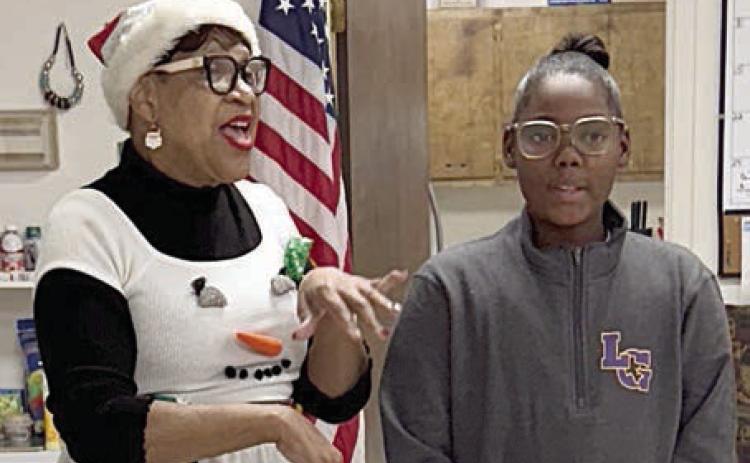 A ‘snowman elf’ dropped by Senior Connections over the holidays to spread some Christmas cheer. Virginia Berry brought gift bags of goodies for the members and sang carols with the help of Alfreda Ellisons’s grandaughter, Reygan Hutchson.