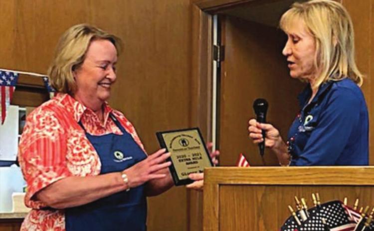 EXTRA MILE AWARD – Recipient Ginger Bosl (left) shown with PAT program director Phyllis Venghaus (right).