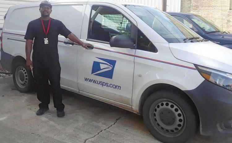 Rural Carrier Marcus Coleman is shown with the new Metris van assigned to R003.
