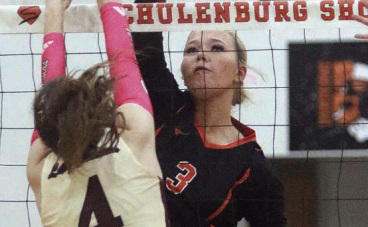 Aubryn Janda sends down the final point of game one in the Lady Horns’ win at home last week. Sticker Photo By Darrell Vyvjala