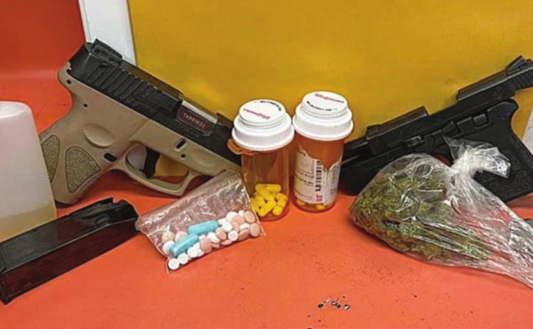 The guns, drugs, and fake urine that were confiscated by the Schulenburg Police Department following a traffic stop on Interstate 10 on Sunday, July 31.