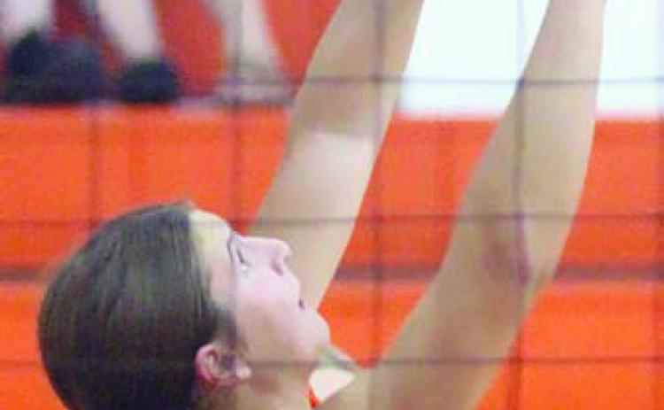 Setter Landry Zapalac tips a ball over in Friday’s scrimmage against Hallettsville. Sticker Photo By Darrell Vyvjala