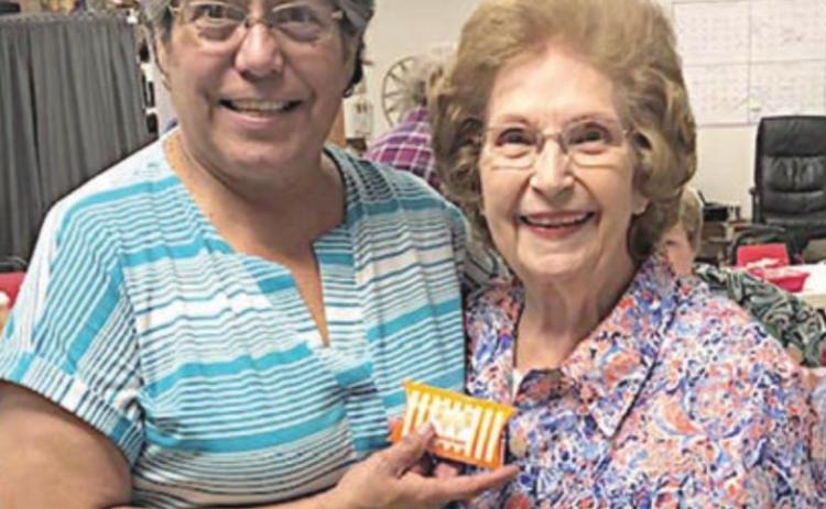 BLACKOUT WINNER – Jeanette Hoelscher (right) of Weimar, won at blackout bingo on Wednesday, Oct. 6. NVCC executive director Cindy Villarreal (left) is also shown.