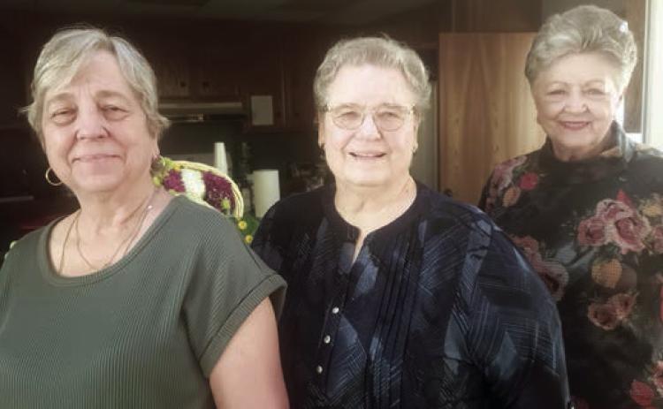 Hostess es were (from left) Debbie Behlen, Janet Kobza and Patricia Greeson.