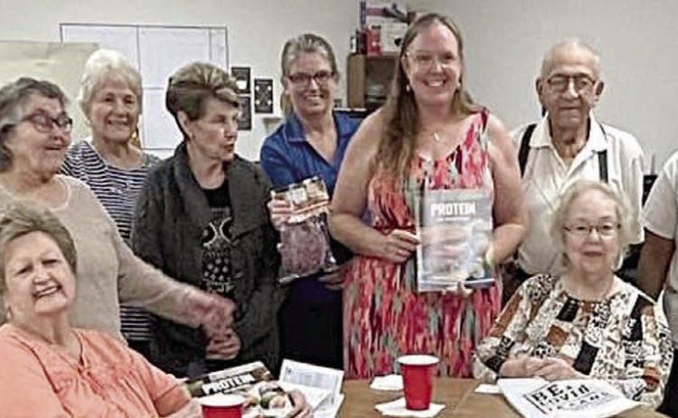 Ten poun ds of groun d beef were donated to Senior Connections by Navidad Valley CattleWomen. Shown are (seated, from left) Judy Klesel, Aileen Kasper, (standing) Margaret Campbell, Carolyn Moore, Betty Mulholland, Dineen Thayer, Tanya Schindler-NVCW, Susie Shank-NVCW, Elroy Dieringer and Darleen Williams.