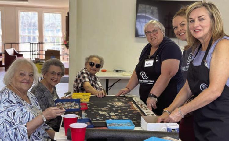 Puzzle addicts in Flatonia just won’t quit – (from left) Laverne Dornak, Jeanette Zouzalik and Gretchen Zapalac, along with volunteers Kathy Carpenter, Kandace Dalmolin and Kitty Wilbanks.