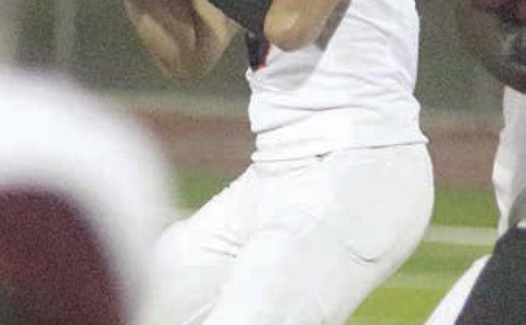 Aaron Janecek surveys the field before hitting Byron Johnson downfield in the first half last Friday in Flatonia. The senior quarterback completed all 11 of his passes, totaling 180 yards, in the Shorthorns’ 63-24 win. He finished the regular season 104-for-159 (65.4 percent) for 1,787 yards with 20 touchdowns and five interceptions. For complete coverage of the game against Flatonia, see SPORTS. Sticker Photo By Darrell Vyvjala