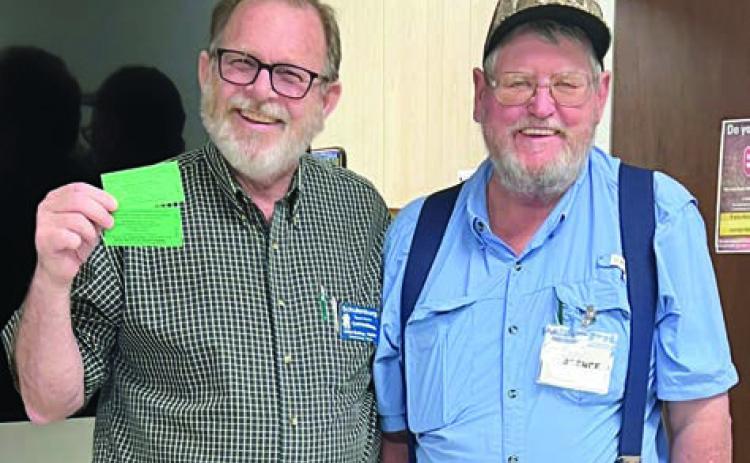 In Shiner blackout bingo , Clarence Ahlschlager (right) won two tickets to the American Legion drive-through dinner, then donated them back, and after another round the winner was Julian Godsey (left). Ahlschlager, a City Alderman, is a Senior Connections member who also serves on the board of directors. Godsey is looking for people who want to dance for fitness in a square/folk dance group.