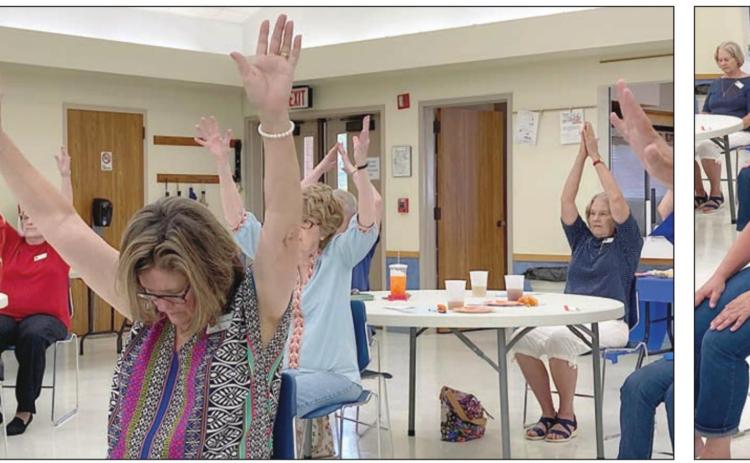 PEGGY O’NEILL (left) spoke about Hatha Yoga and led members of the Fayette County Retired Teachers’ Association in a number of postures and breathing exercises during the meeting on Monday, May 9.