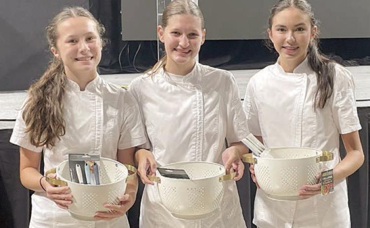 Food Challenge – (from left) Eleanor Carey, Elena Supak and Tori Newton, first in the side dish category and reserve champion team overall advancing to national competition.