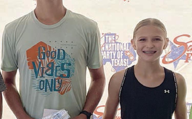 Overall 5K winners – (from left) Ty Lewis and Avery Lewis. Sticker Photo By Darrell Vyvjala